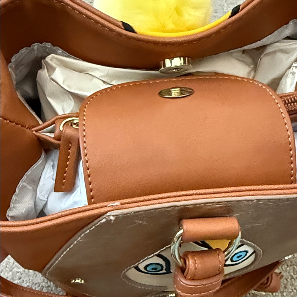Brown Backpack with Silver Wings and Yellow Pom Pom - Picture 3 of 3